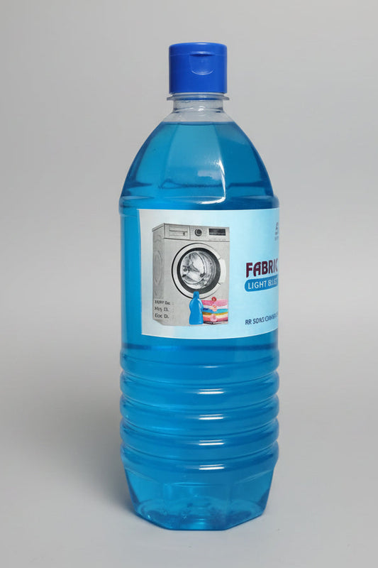 A bottle of Fab Refresher laundry detergent filled with bright blue liquid, featuring a white label with a washing machine graphic and a blue cap, resting on a speckled countertop.